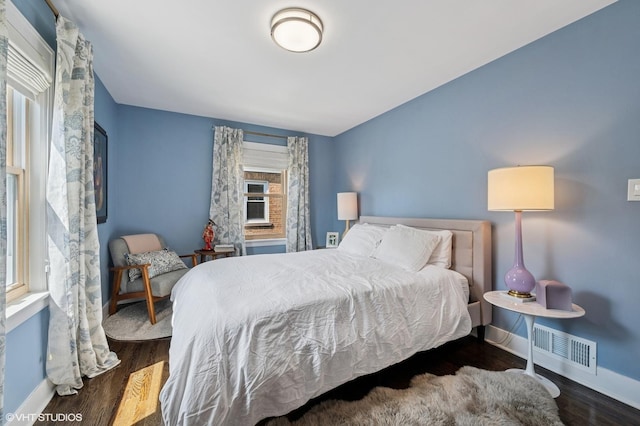 5146 N Mobile Ave, Chicago, IL 60630 - bedroom with baseboards and wood finished floors