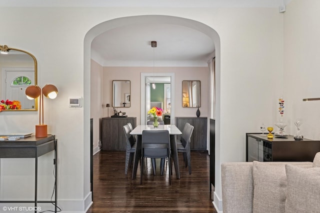 5146 N Mobile Ave, Chicago, IL 60630 - dining area with arched walkways, wood finished floors, and baseboards