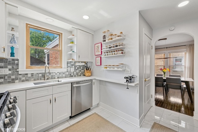 5146 N Mobile Ave, Chicago, IL 60630 - kitchen featuring stainless steel dishwasher, open shelves, a sink, light marble finish floors, and recessed lighting