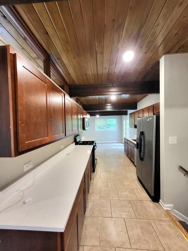 2913 Balmoral Cres, Flossmoor, IL 60422 - kitchen with appliances with stainless steel finishes, wood ceiling, light countertops, and light tile patterned floors