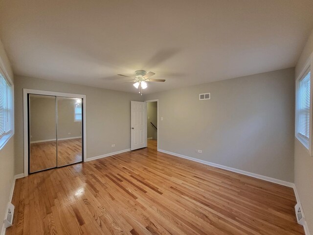 2913 Balmoral Cres, Flossmoor, IL 60422 - unfurnished bedroom featuring multiple windows, wood finished floors, and a ceiling fan
