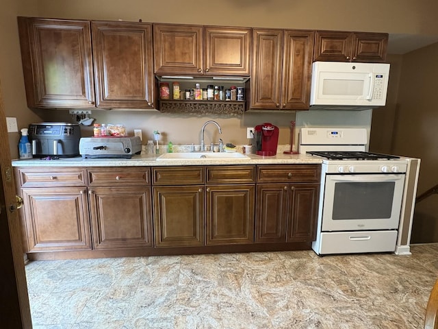 220 Harrison St, Carpentersville, IL 60110 - kitchen with white appliances, a sink, and light countertops