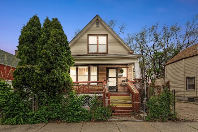 6108 S Honore St, Chicago, IL 60636 - view of front facade with a porch and a gate