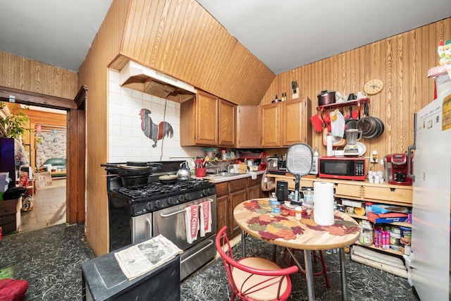 6108 S Honore St, Chicago, IL 60636 - kitchen with stainless steel range with gas cooktop, wooden walls, and brown cabinetry