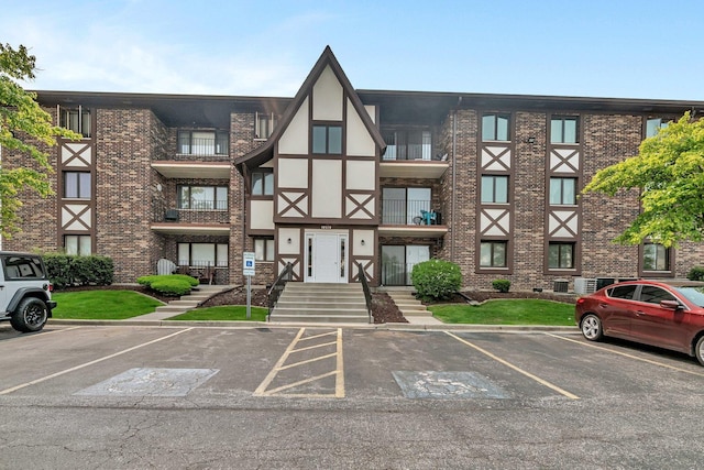 10528 Ridge Cove Dr Unit 11A, Chicago Ridge, IL 60415 - view of building exterior with uncovered parking