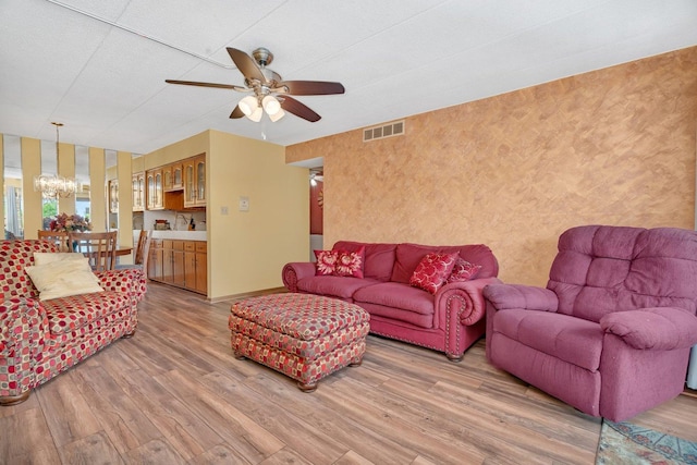 10528 Ridge Cove Dr Unit 11A, Chicago Ridge, IL 60415 - living area with a chandelier, light wood-type flooring, a ceiling fan, baseboards, and wallpapered walls