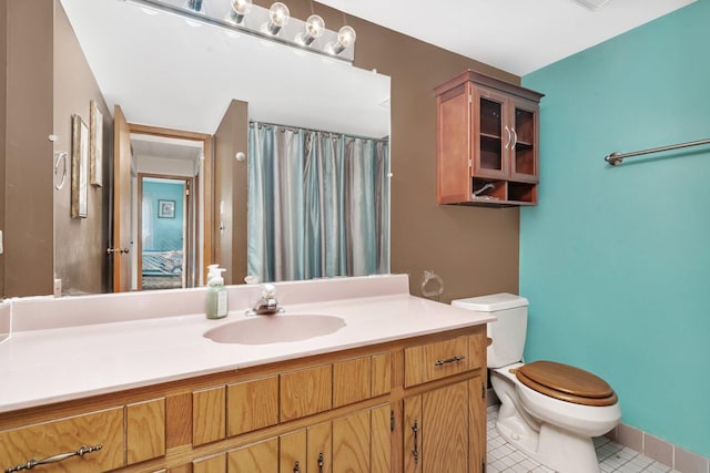10528 Ridge Cove Dr Unit 11A, Chicago Ridge, IL 60415 - bathroom featuring toilet, vanity, tile patterned floors, and a shower with curtain