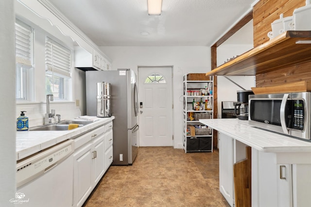 915 E Duane Blvd, Kankakee, IL 60901 - kitchen with stainless steel appliances, a sink, white cabinetry, and light floors