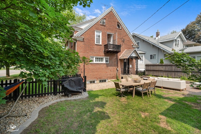 915 E Duane Blvd, Kankakee, IL 60901 - back of property featuring an outdoor hangout area, brick siding, and a balcony