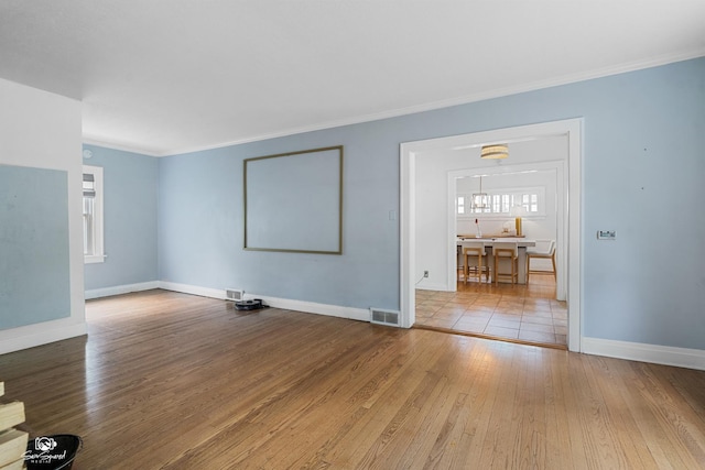 915 E Duane Blvd, Kankakee, IL 60901 - spare room featuring hardwood / wood-style flooring, baseboards, and ornamental molding