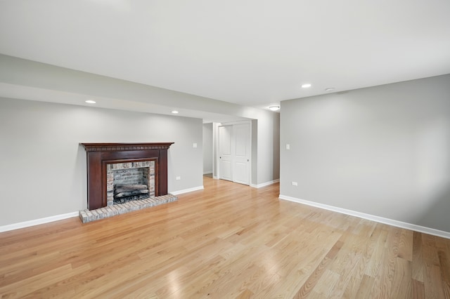 8306 Regency Ct, Willow Springs, IL 60480 - unfurnished living room with a brick fireplace, recessed lighting, light wood-style flooring, and baseboards