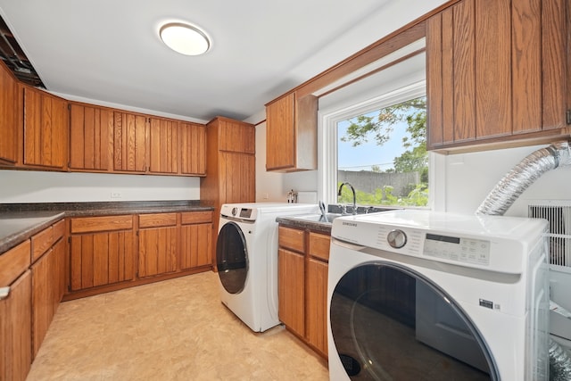 8306 Regency Ct, Willow Springs, IL 60480 - laundry room with cabinet space, light floors, and washer and clothes dryer