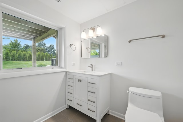 8306 Regency Ct, Willow Springs, IL 60480 - half bathroom with toilet, vanity, baseboards, and tile patterned flooring