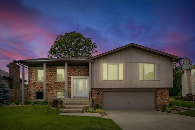 8306 Regency Ct, Willow Springs, IL 60480 - split foyer home featuring a garage, brick siding, and concrete driveway