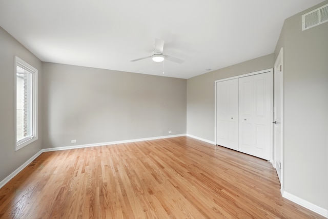 8306 Regency Ct, Willow Springs, IL 60480 - unfurnished bedroom with light wood finished floors, baseboards, a closet, and a ceiling fan