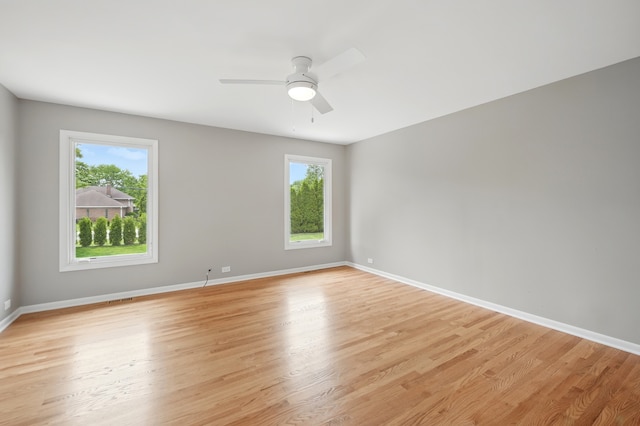 8306 Regency Ct, Willow Springs, IL 60480 - empty room with light wood-type flooring, ceiling fan, and baseboards