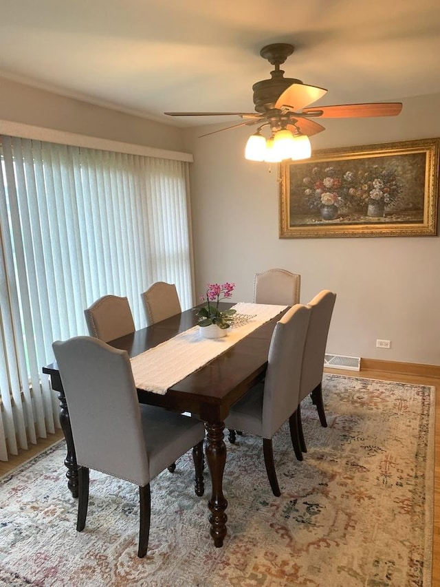 8500 W Winona St, Chicago, IL 60656 - dining room featuring a ceiling fan and wood finished floors