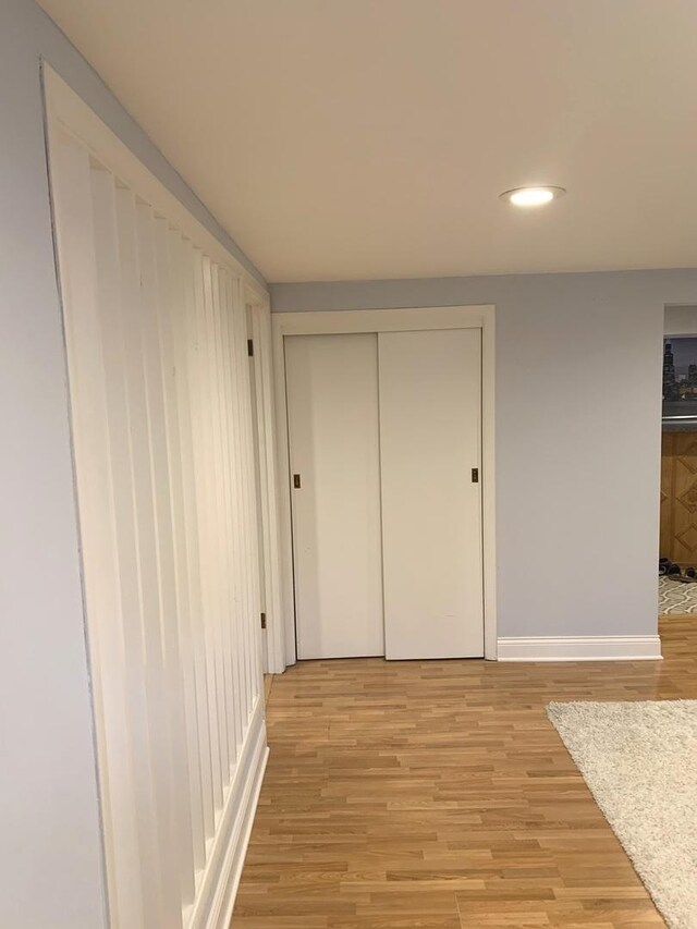 8500 W Winona St, Chicago, IL 60656 - hallway featuring light wood-style floors, baseboards, and recessed lighting