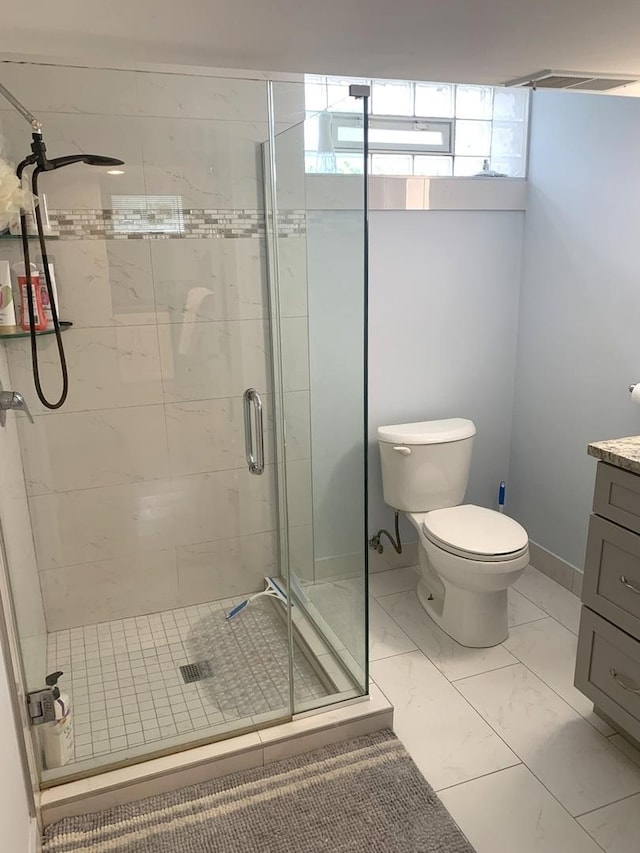 8500 W Winona St, Chicago, IL 60656 - full bath featuring toilet, a stall shower, marble look tile flooring, and vanity