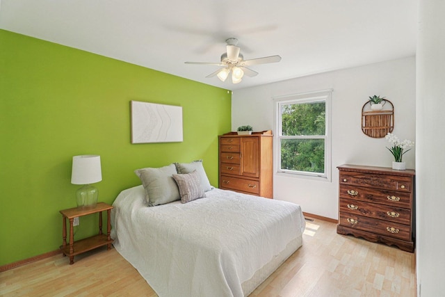1705 N Donovan St, Mchenry, IL 60050 - bedroom featuring light wood-style flooring, baseboards, and a ceiling fan