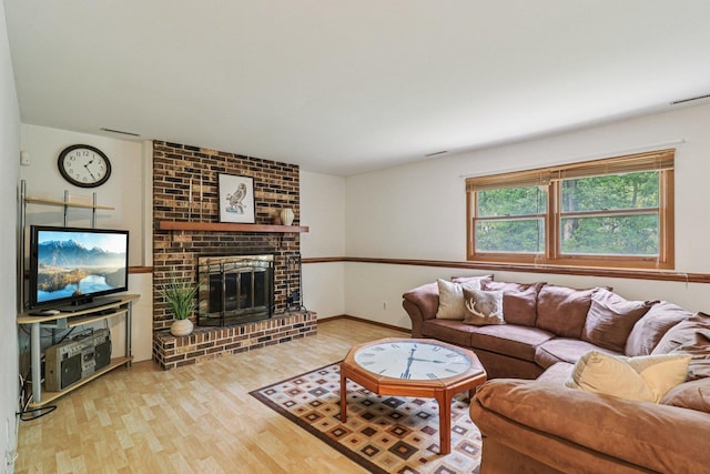 1705 N Donovan St, Mchenry, IL 60050 - living area with wood finished floors, a fireplace, and baseboards