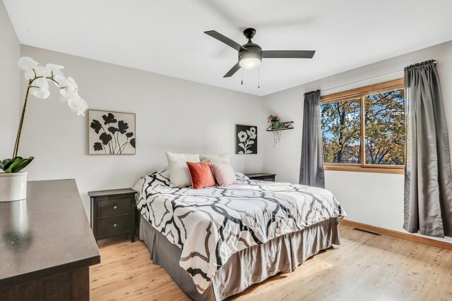 25911 W Highpoint Rd, Ingleside, IL 60041 - bedroom with light wood-style flooring, baseboards, and ceiling fan