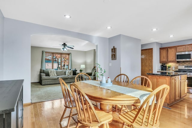 25911 W Highpoint Rd, Ingleside, IL 60041 - dining room with arched walkways, ceiling fan, light wood finished floors, recessed lighting, and baseboards