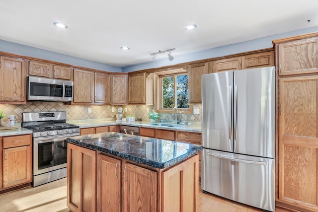 25911 W Highpoint Rd, Ingleside, IL 60041 - kitchen with appliances with stainless steel finishes, a sink, a center island, decorative backsplash, and recessed lighting