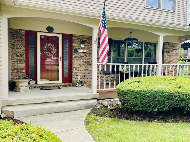 17581 W Summit Dr, Grayslake, IL 60030 - doorway to property featuring brick siding and covered porch