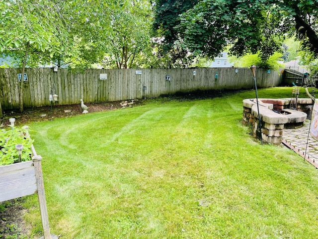 17581 W Summit Dr, Grayslake, IL 60030 - fenced backyard with an outdoor fire pit