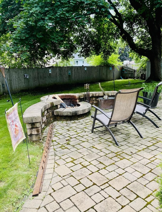 17581 W Summit Dr, Grayslake, IL 60030 - fenced backyard featuring a fire pit and a patio area
