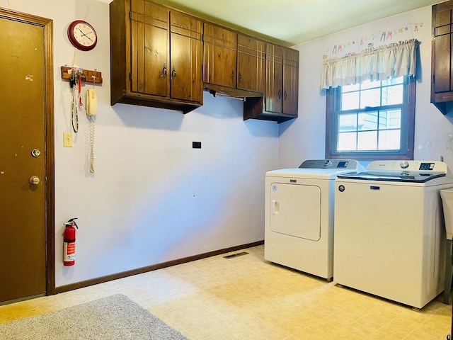 17581 W Summit Dr, Grayslake, IL 60030 - washroom featuring cabinet space, washer and clothes dryer, and light flooring