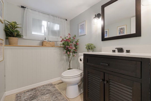 6130 Belmont Rd, Downers Grove, IL 60516 - bathroom with vanity, toilet, tile patterned flooring, and baseboards