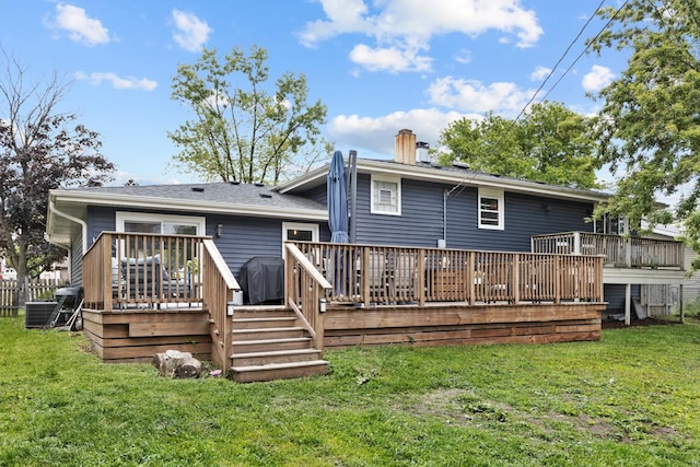 6130 Belmont Rd, Downers Grove, IL 60516 - rear view of property with a chimney, a deck, central AC, and a yard