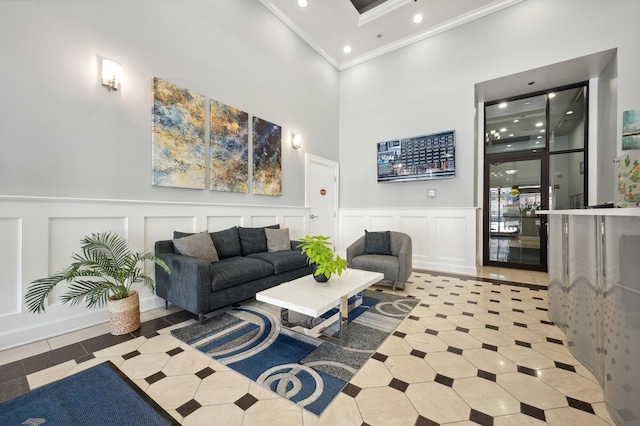 1464 S Michigan Ave Unit 2203, Chicago, IL 60605 - living room with ornamental molding, a decorative wall, a high ceiling, recessed lighting, and a wainscoted wall