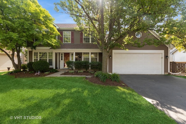 1544 Birmingham Ln, Crystal Lake, IL 60014 - view of front of house with asphalt driveway, a front yard, and a garage