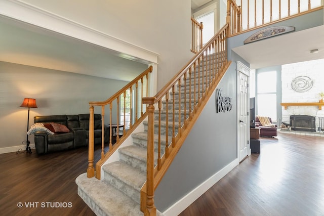 1544 Birmingham Ln, Crystal Lake, IL 60014 - stairs featuring plenty of natural light, wood finished floors, baseboards, a high ceiling, and a fireplace