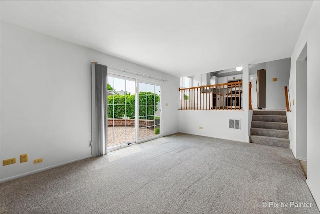 2121 Baldwin Ln, Hanover Park, IL 60133 - unfurnished living room featuring carpet flooring and stairway