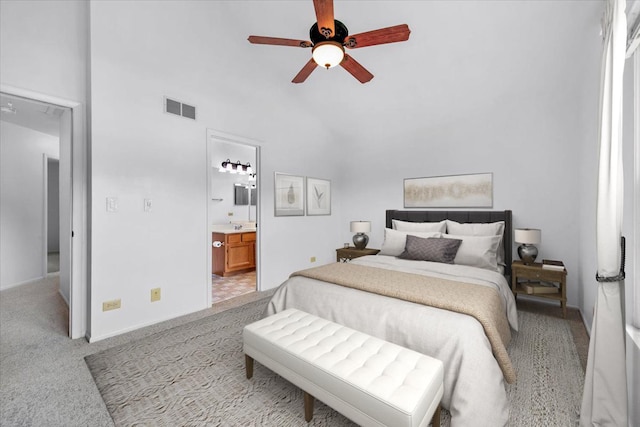 2121 Baldwin Ln, Hanover Park, IL 60133 - bedroom featuring light carpet, connected bathroom, ceiling fan, baseboards, and lofted ceiling
