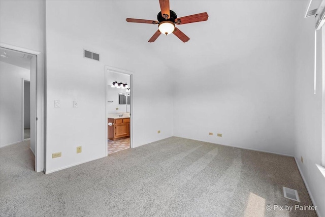 2121 Baldwin Ln, Hanover Park, IL 60133 - unfurnished bedroom with carpet flooring, ensuite bathroom, vaulted ceiling, and a ceiling fan