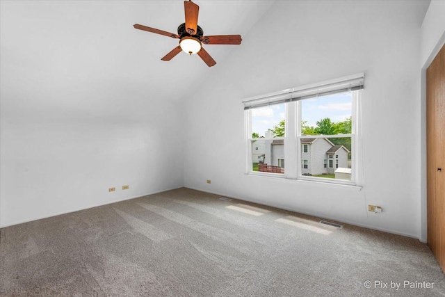 2121 Baldwin Ln, Hanover Park, IL 60133 - empty room with carpet floors, ceiling fan, and high vaulted ceiling