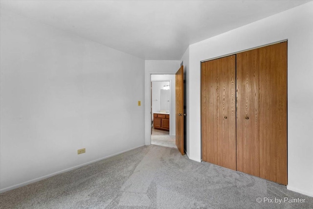 2121 Baldwin Ln, Hanover Park, IL 60133 - unfurnished bedroom featuring carpet, a closet, and baseboards