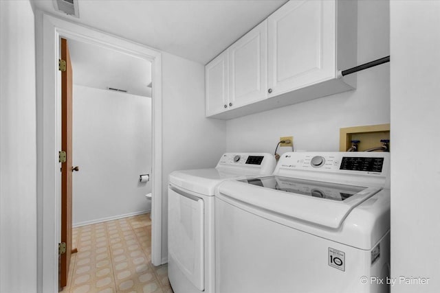 2121 Baldwin Ln, Hanover Park, IL 60133 - washroom with cabinet space, light flooring, and independent washer and dryer