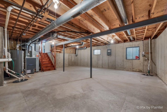 2121 Baldwin Ln, Hanover Park, IL 60133 - basement featuring stairway, electric panel, heating unit, and drainage system