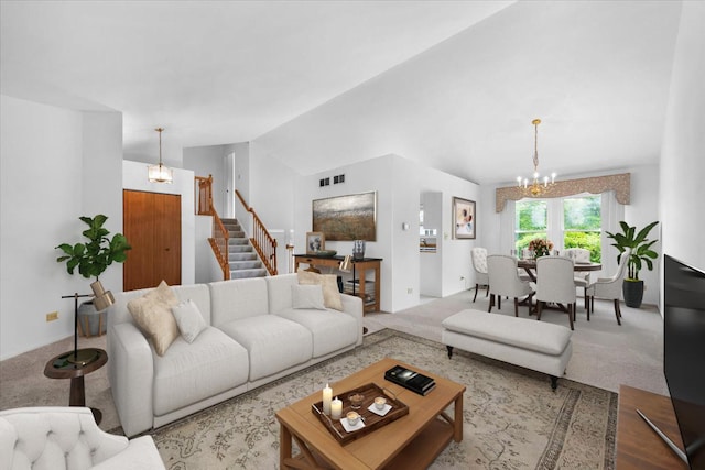 2121 Baldwin Ln, Hanover Park, IL 60133 - carpeted living room with a chandelier, stairs, and vaulted ceiling
