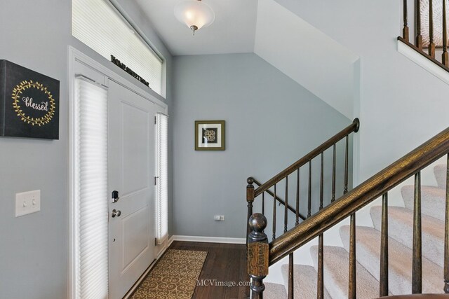 337 Bennett Dr, Carol Stream, IL 60188 - foyer featuring dark wood-type flooring, stairs, lofted ceiling, and baseboards
