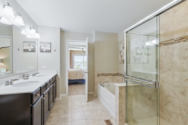 337 Bennett Dr, Carol Stream, IL 60188 - ensuite bathroom with double vanity, a garden tub, a stall shower, and tile patterned floors