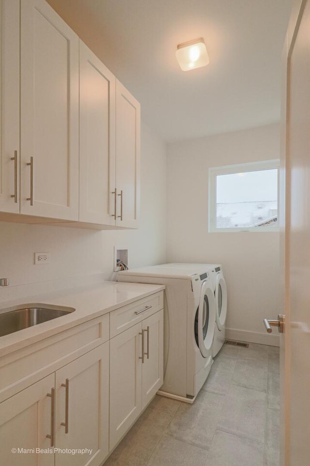 6123 S Ellis Ave, Chicago, IL 60637 - washroom with cabinet space, washer and clothes dryer, and baseboards