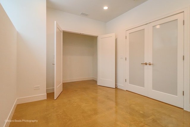 6123 S Ellis Ave, Chicago, IL 60637 - unfurnished bedroom featuring concrete flooring, baseboards, recessed lighting, and a closet