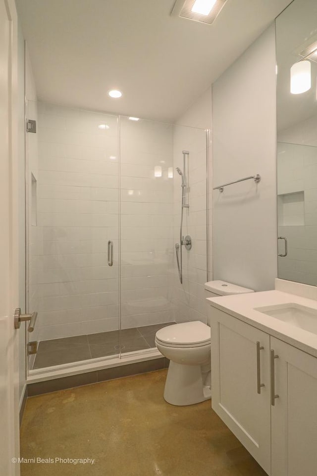 6123 S Ellis Ave, Chicago, IL 60637 - bathroom featuring toilet, vanity, a shower stall, concrete flooring, and recessed lighting